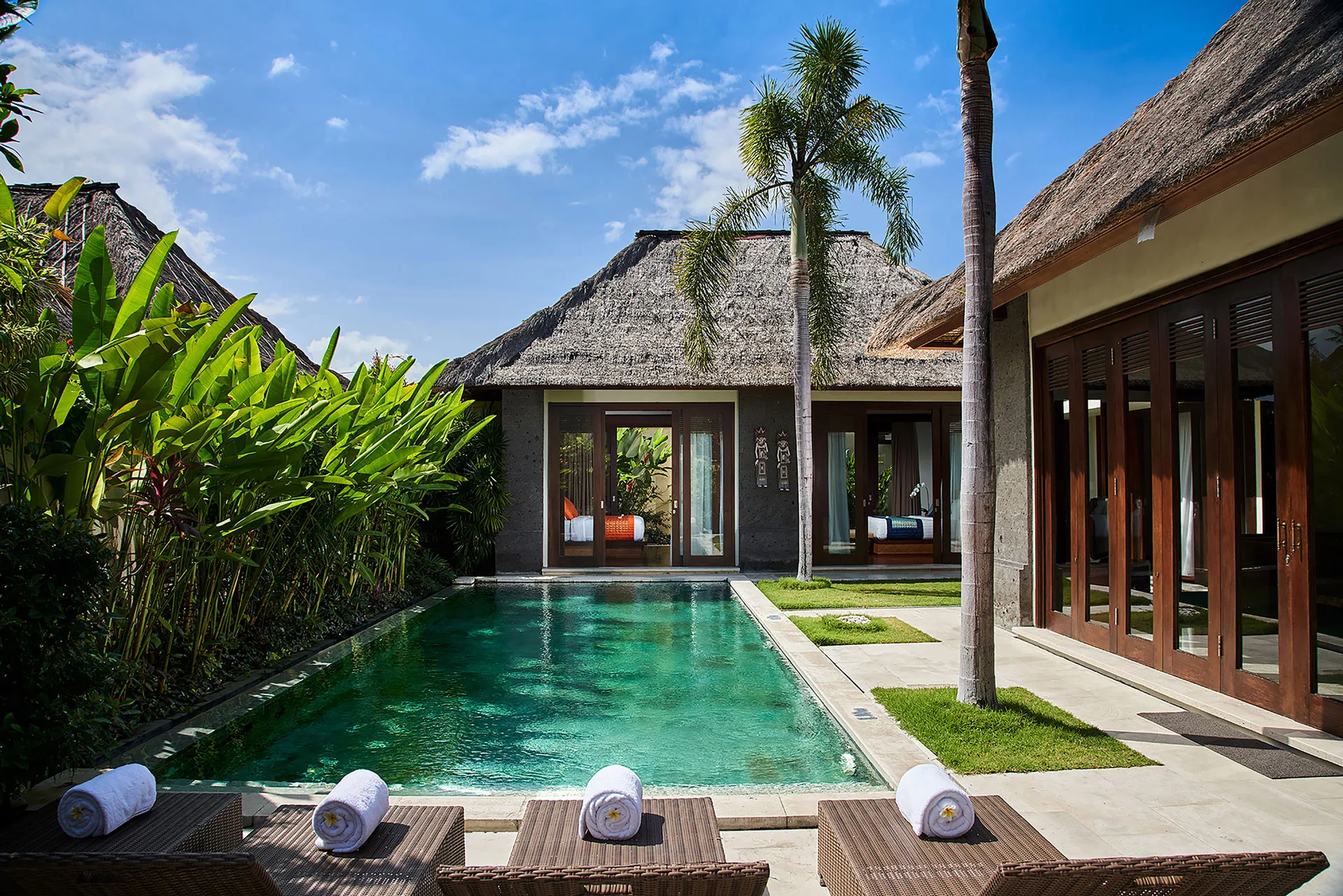 Large private pool and shared living space of the Three Bedroom Pool Villa